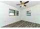 Bedroom with modern flooring, ceiling fan, and natural light from the windows at 707 N Solandra Dr, Orlando, FL 32807
