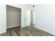 Bedroom featuring wood-look floors and a spacious closet at 707 N Solandra Dr, Orlando, FL 32807