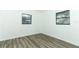 Bedroom with modern flooring and natural light from the windows at 707 N Solandra Dr, Orlando, FL 32807