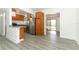 Updated kitchen featuring stainless steel appliances, granite countertops, and sleek gray flooring throughout the home at 707 N Solandra Dr, Orlando, FL 32807