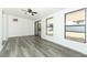 Bright living room with large windows, sliding door, and views of the patio and backyard at 707 N Solandra Dr, Orlando, FL 32807