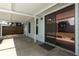 Back patio area with a covered area, accessible through sliding glass doors at 707 N Solandra Dr, Orlando, FL 32807
