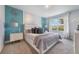 Elegant bedroom featuring decorative wall art and a cozy, well-lit atmosphere for a restful retreat at 746 Mocking Jay Ln, St Cloud, FL 34771
