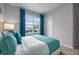 Bright bedroom featuring a large window with picturesque views, enhancing the cozy and inviting atmosphere at 746 Mocking Jay Ln, St Cloud, FL 34771