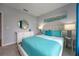 Comfortable bedroom featuring stylish decor, a plush bed, and ample natural light for a relaxing ambiance at 746 Mocking Jay Ln, St Cloud, FL 34771