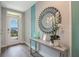 Stylish entryway featuring a decorative mirror, modern console table, and tasteful accents at 746 Mocking Jay Ln, St Cloud, FL 34771