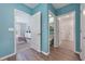 Hallway showcasing doorways to bedroom, bathroom, and walk-in closet, with coordinated color scheme at 746 Mocking Jay Ln, St Cloud, FL 34771