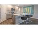 Beautiful kitchen with a spacious island, seating, and modern stainless steel appliances at 746 Mocking Jay Ln, St Cloud, FL 34771