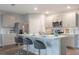 Contemporary kitchen boasting stainless steel appliances, ample counter space, and bar seating at 746 Mocking Jay Ln, St Cloud, FL 34771