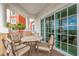 Relax on this covered balcony with seating, offering a space for outdoor enjoyment and relaxation at 7593 Gathering Dr # 502, Reunion, FL 34747