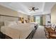 Bedroom featuring two large beds, side tables, ceiling fan, and a tranquil atmosphere at 7593 Gathering Dr # 502, Reunion, FL 34747