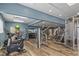 Spacious gym with exercise bikes, weights, and machines for a complete workout in a well-lit room at 7593 Gathering Dr # 502, Reunion, FL 34747