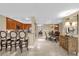 Living area features a breakfast bar, view of the dining area, and access to hallway and kitchen space at 7593 Gathering Dr # 502, Reunion, FL 34747