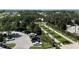 Overhead view of an ample parking area with palm trees and manicured landscaping at 7593 Gathering Dr # 502, Reunion, FL 34747