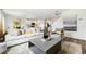 A well-lit open living space combining living, dining, and kitchen areas, designed for modern living at 776 Mocking Jay Ln, St Cloud, FL 34771