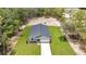 Aerial view of a home on a large lot with beautiful landscaping and a long driveway at 8202 Sw 123Rd Ter, Dunnellon, FL 34432