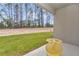Back patio with a lush green yard and view of the surrounding forest at 8202 Sw 123Rd Ter, Dunnellon, FL 34432