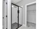 Modern bathroom with a glass-enclosed shower, and convenient access to closet storage at 8202 Sw 123Rd Ter, Dunnellon, FL 34432