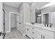 Elegant bathroom featuring dual vanities, white countertops, and modern fixtures at 8202 Sw 123Rd Ter, Dunnellon, FL 34432