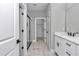 Bathroom area with wood tile flooring, a glass-enclosed shower, and ample storage space at 8202 Sw 123Rd Ter, Dunnellon, FL 34432