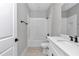 Modern bathroom featuring white subway tile in shower/tub area and granite-look vanity at 8202 Sw 123Rd Ter, Dunnellon, FL 34432