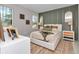 Inviting bedroom showcases a comfortable bed, accent wall, coordinated decor, and ample natural light at 8202 Sw 123Rd Ter, Dunnellon, FL 34432
