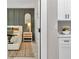 Stylish bedroom featuring modern decor, neutral tones, a comfortable bed, and a seamless transition to a closet at 8202 Sw 123Rd Ter, Dunnellon, FL 34432