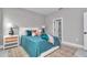 Comfortable bedroom with a decorative rug, bedside lamps, and tasteful decor at 8202 Sw 123Rd Ter, Dunnellon, FL 34432