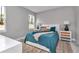 Relaxing bedroom with soft lighting, a comfortable bed, and a view of the outdoors at 8202 Sw 123Rd Ter, Dunnellon, FL 34432