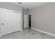 This bedroom features wood-style flooring and a closet with sliding doors at 8202 Sw 123Rd Ter, Dunnellon, FL 34432