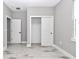 Neutral bedroom with wood-look tile flooring, closet, and natural light at 8202 Sw 123Rd Ter, Dunnellon, FL 34432