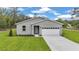 Attractive single-Gathering home with a two-car garage, manicured lawn, and tasteful landscaping at 8202 Sw 123Rd Ter, Dunnellon, FL 34432