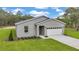 Charming single-Gathering home with a two-car garage, manicured lawn, and tasteful landscaping at 8202 Sw 123Rd Ter, Dunnellon, FL 34432