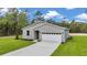 Attractive single-Gathering home with a two-car garage, manicured lawn, and tasteful landscaping at 8202 Sw 123Rd Ter, Dunnellon, FL 34432