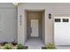 Welcoming front entrance with a white door and well-kept surroundings at 8202 Sw 123Rd Ter, Dunnellon, FL 34432