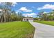 Well-maintained home with a concrete driveway and green lawn at 8202 Sw 123Rd Ter, Dunnellon, FL 34432