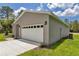 Attached two-car garage with a white door offering convenient parking and storage at 8202 Sw 123Rd Ter, Dunnellon, FL 34432