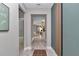 Elegant hallway with light wood flooring and modern wall paneling at 8202 Sw 123Rd Ter, Dunnellon, FL 34432