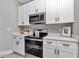 This kitchen features stainless steel appliances and ample cabinet space at 8202 Sw 123Rd Ter, Dunnellon, FL 34432