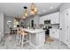 This kitchen features an island with seating and stainless steel appliances at 8202 Sw 123Rd Ter, Dunnellon, FL 34432
