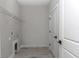 This laundry room features a utility sink hookups and access to the home at 8202 Sw 123Rd Ter, Dunnellon, FL 34432