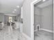 Bright laundry room with a view of the open-concept kitchen and dining area at 8202 Sw 123Rd Ter, Dunnellon, FL 34432