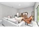 Bright living room featuring gray walls, modern furniture, and lots of natural light at 8202 Sw 123Rd Ter, Dunnellon, FL 34432