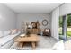 Bright living room features modern furnishings, stylish decor, and sliding doors to the outdoor patio at 8202 Sw 123Rd Ter, Dunnellon, FL 34432
