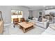 Open living area with neutral tones, cozy seating, and a seamless flow to the outdoors at 8202 Sw 123Rd Ter, Dunnellon, FL 34432