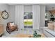 Serene living room showcases sliding doors to the backyard, natural light, and stylish furniture at 8202 Sw 123Rd Ter, Dunnellon, FL 34432