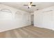 Bedroom features neutral carpet, three architectural niches, and a closet at 9532 Water Fern Cir, Clermont, FL 34711