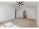 Bedroom features neutral carpet and an arched doorway at 9532 Water Fern Cir, Clermont, FL 34711
