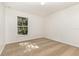 Clean and simple bedroom with a window and neutral carpet at 9532 Water Fern Cir, Clermont, FL 34711