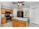 Charming kitchen with stainless steel appliances, tile flooring, and a center island at 9532 Water Fern Cir, Clermont, FL 34711